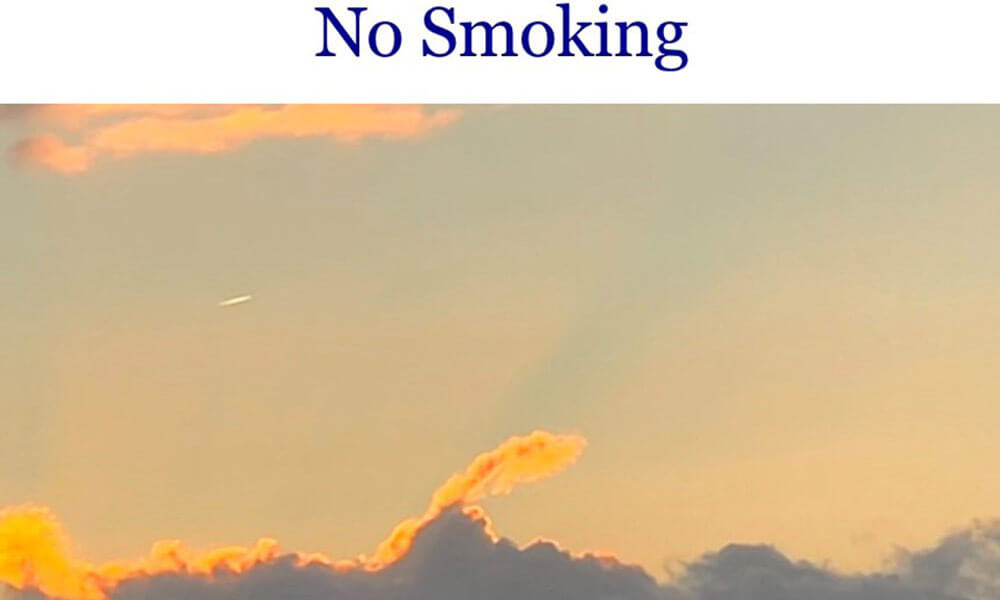No-Smoking-Schriftzug über Abendhimmel – Symbolbild für Rauchstopp